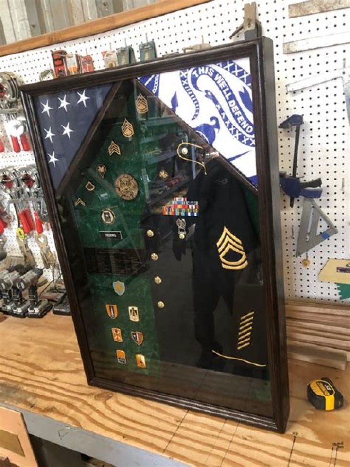How do you mount a uniform in a shadow box?