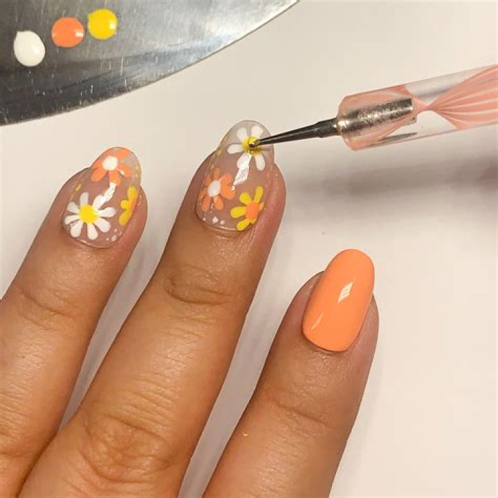 How do you paint flowers on nails?